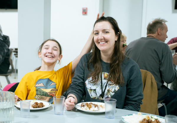 Rachel at supper with a girl